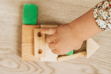 hand with wooden blocks