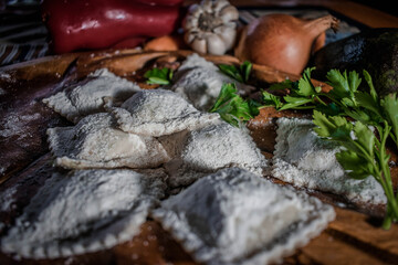 homemade ravioli with vegetables, bell peppers, garlic and parsley