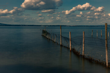 Fototapeta premium Old remains pier on the lake