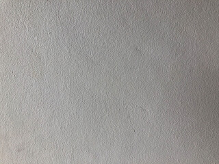 The gray cement background wall has a pattern made of cement plaster.
