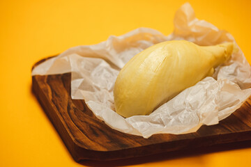 Durian ripe on a yellow background