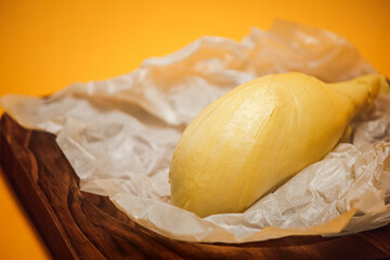 Durian ripe on a yellow background