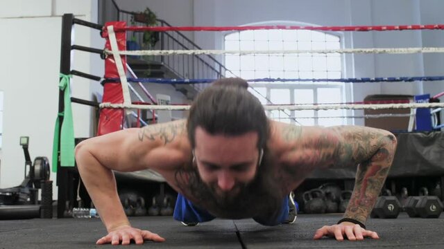 MS Man doing push ups in gym / Milan, Italy