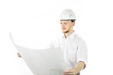 Satisfied handsome engineer in safety helmet working with blueprint documents isolated on white background. Successful man from industrial sphere, building sector, construction industry