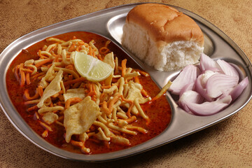 A popular Indian food item from Maharashtra, called misal pav. Misal pav is a gravy based food item eaten with Indian bread, very popular in Maharashtrian food item.