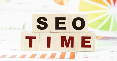 words seo time made with black letters on wooden blocks