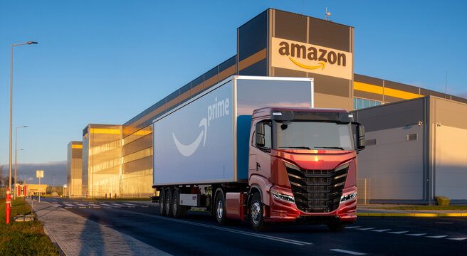 Trucks transporting semi-trailers with the Amazon Prime logo to the Amazon logistics center