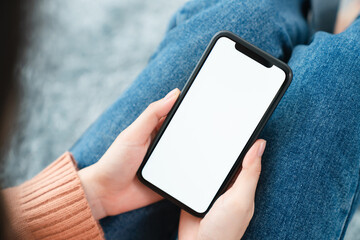 Hand holding smartphone mockup of blank screen. Take your screen to put on advertising.