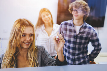 Group of male and female students preparing for lesson sharing thoughts 