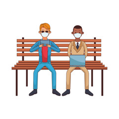 interracial men wearing medical masks using technology seated in park chair