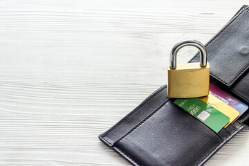 Naklejka premium Credit card data security concept with lock on white wooden table copyspace