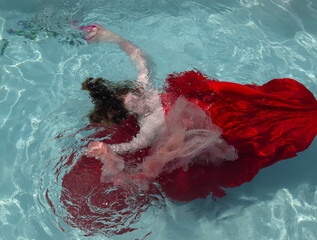 Red dress woman underwater