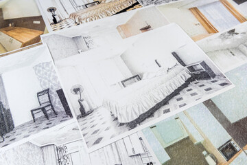 Drawings of a house or apartment are on the table. Designer desk with graphic outline of apartment....