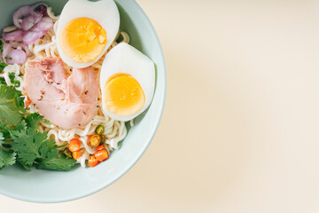 Top view - Tom Yum soup with instant noodle in the big bowl.