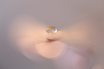 Waterdrop on an abstract leaf with pastel colors