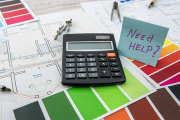 Arcitechture blueprint for renovation home. Color catalog with house sketch at  office desk