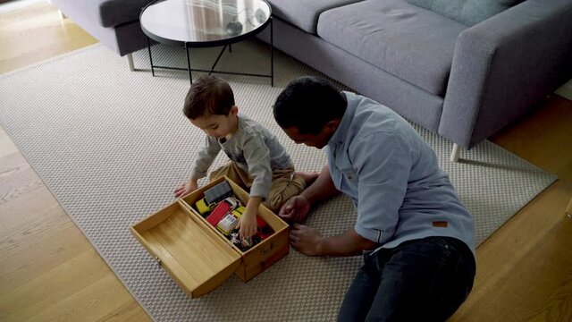 MS Father and son (2-3) playing with car toys / Denmark