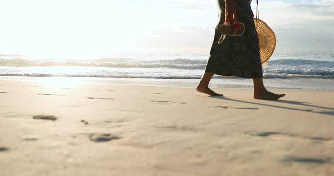 MS TS Woman in long dress walking on beach / Bermuda