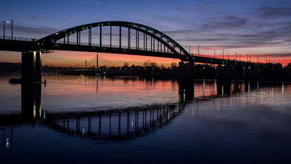 Obraz na płótnie Canvas Belgrade, Serbia - Bridges spanning the Sava River at sunset