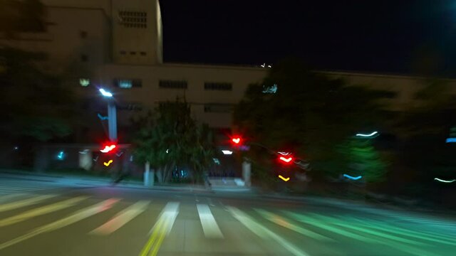 T/L WS POV Traffic on downtown streets at night / Los Angeles, California, USA