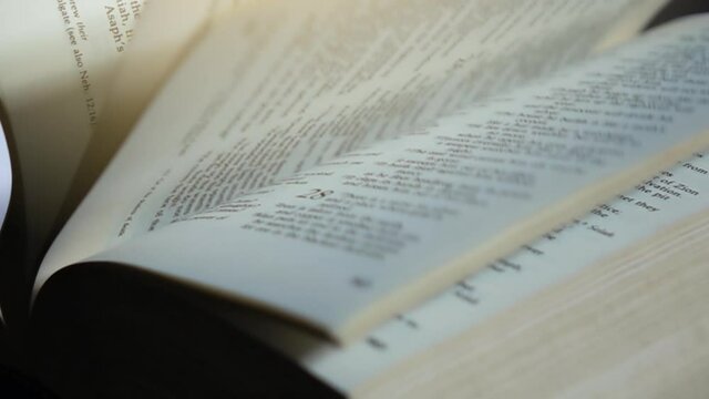 Slow Motion Of Turning Pages Of Bible Book.