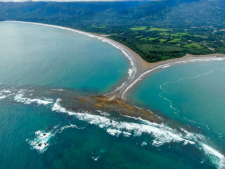 Beautiful aerial view of the majestic whale tale in the beach of the National park Marino Ballena...