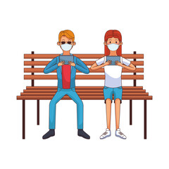 young couple wearing medical mask using technology seated in park chair