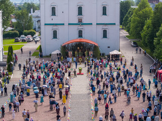 KOLOMNA, MOSCOW REGION, RUSSIA - JUNE 7, 2020: An aerial view of believers observing social distancing in front of the Assumption Cathedral during a religious service.