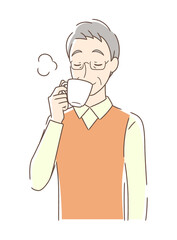 マグカップのコーヒーを飲む男性