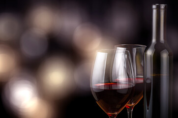two glasses and bottle with red wine on bright background