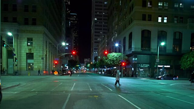 T/L WS POV Traffic on downtown streets at night / Los Angeles, California, USA