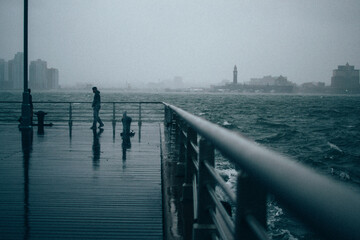 Pier before the storm with man