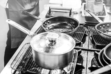 Chef cooking in a kitchen, chef at work, Black & White.