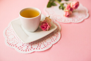 Cup of tea on soft pink background