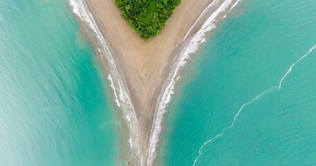 Beautiful aerial view of the majestic whale tale in the beach of the National park Marino Ballena in Costa Rica 