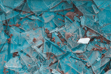 A shattered window on the ground. Broken glass background. Shards.