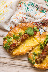 Hot pizza with sausage and cheese on wooden table. Food concept