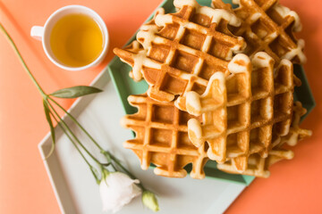 Viennese waffles on coral background