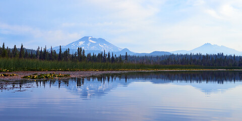 Panoramic view of the South Sister mountain in the morning with reflection in the Hosmer Lake in Central Oregon.