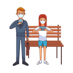 young couple wearing medical mask using technology seated in park chair