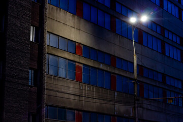 Fototapeta na wymiar Street lamp light on old factory building