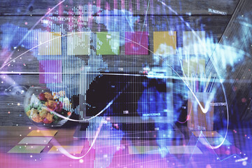 Double exposure of business theme icons and work space with computer background. Concept of success.