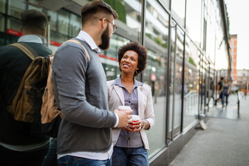 Business people talking outside company with holding coffee break time concept.