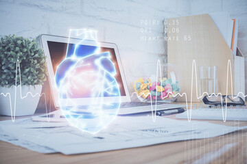Desktop computer background and heart drawing. Double exposure. Medical study and healthcare concept.