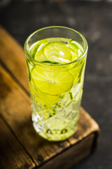 Colorful cocktail with thin lime slices. Selective focus. Shallow depth of field. 
