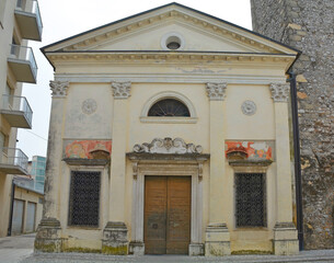 Obraz premium The historic Chiesa di San Giovanni dei Battuti church in Spilimbergo, Friuli-Venezia Giulia, north east Italy, dating from 1346. The bell tower can be seen on the right 