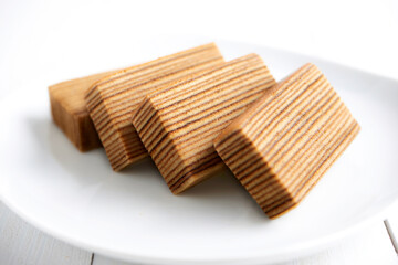 traditional indonesian kek lapis (layered cake) isolated with white background