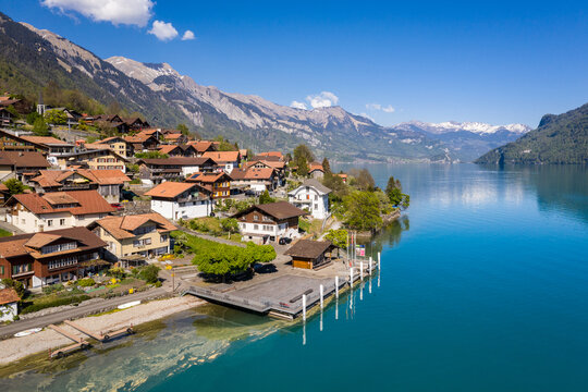Idyllic Oberried village by the alpine lake Brienz in Bern, Switzerland on a sunny day