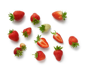 Fototapeta na wymiar whole and halves of fresh ripe red strawberries with green ponytails isolated on a white background