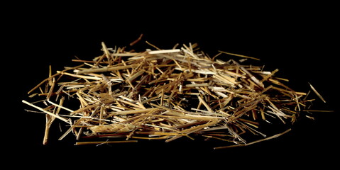 Straw, thatch, hay pile isolated on black background and texture